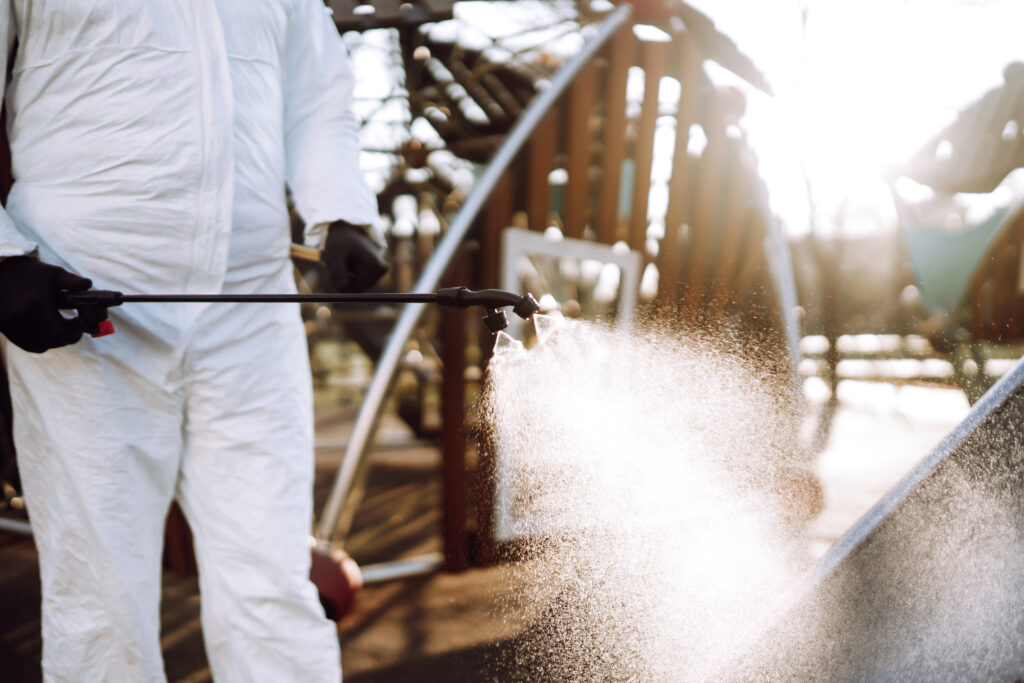 man wearing protective suit disinfecting the playg 2026 03 20 04 47 15 utc
